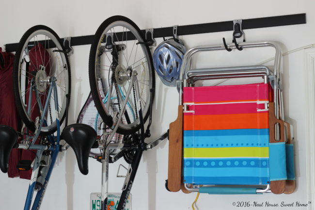 How to install vertical storage in the garage walls. Clean up your garage with Rubbermaid® FastTrack® Garage Organization System. #GarageCleanUp #ad