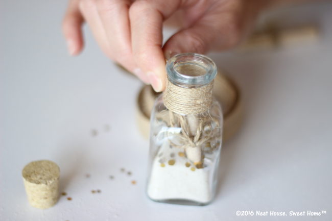 DIY Footprints in the Sand Baptism Favors | An excerpt of this beautiful prayer is tucked inside these miniature glass jars. This is a beautiful keepsake for Baptism, Dedication, and First Communion.